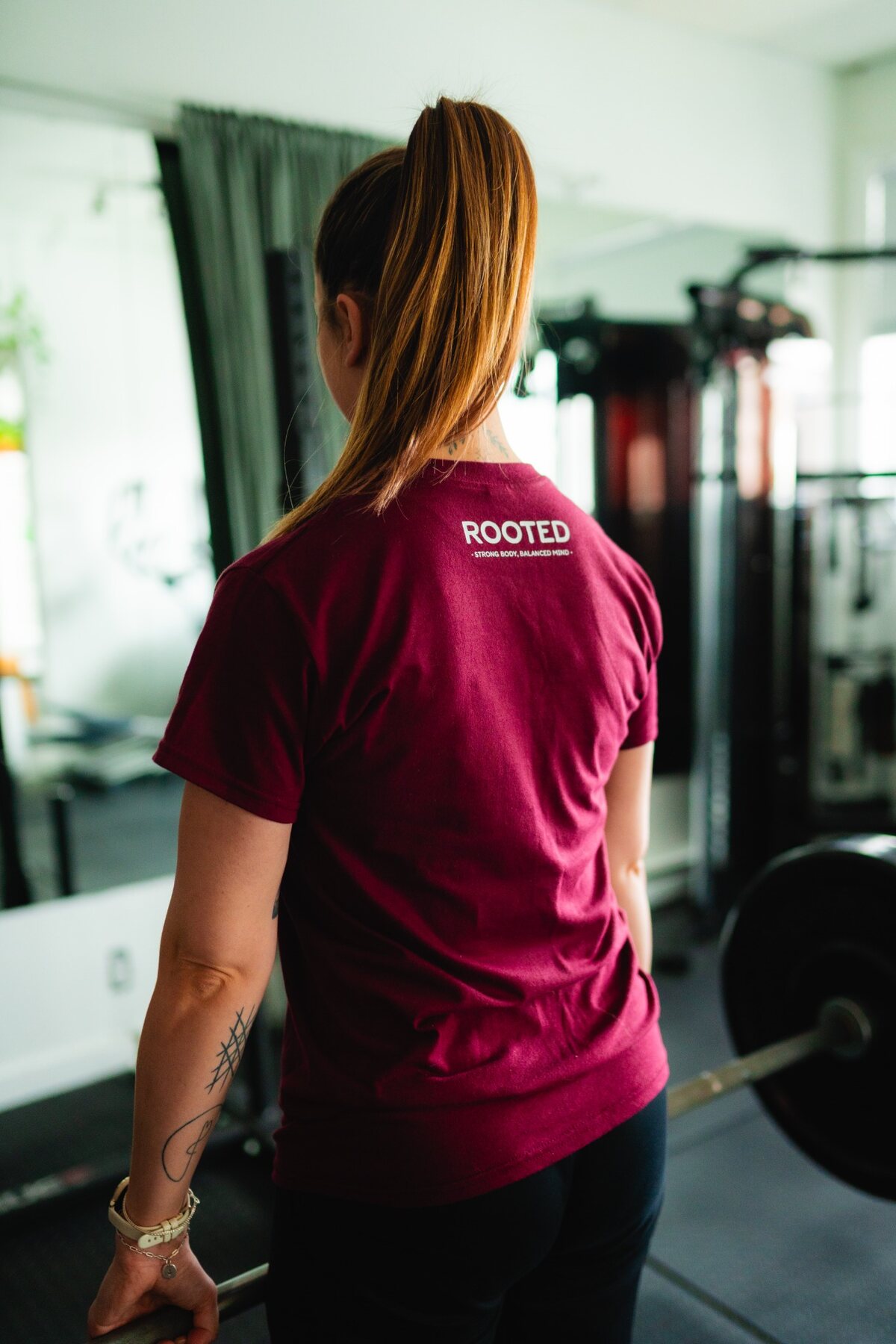 Rooted Fitness and Yoga apparel photographed inside the gym